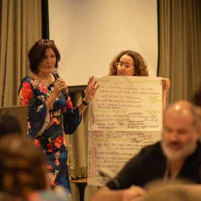 2025-Highlights-20 Fiona Lawton and Louise Healy presenting group activity feedback