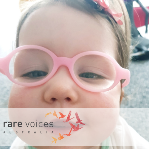 Eva with pink glasses smiling