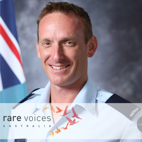 Tim in uniform smiling