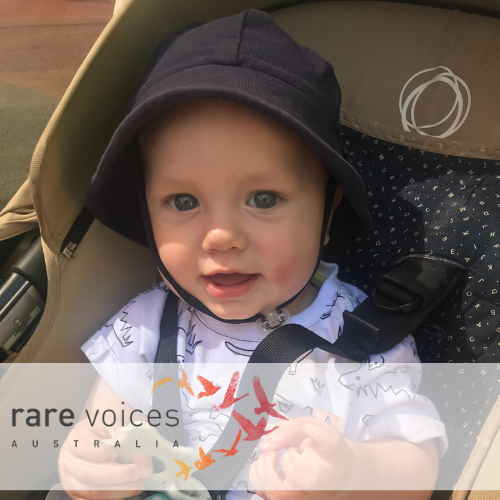Willing smiling in baby seat