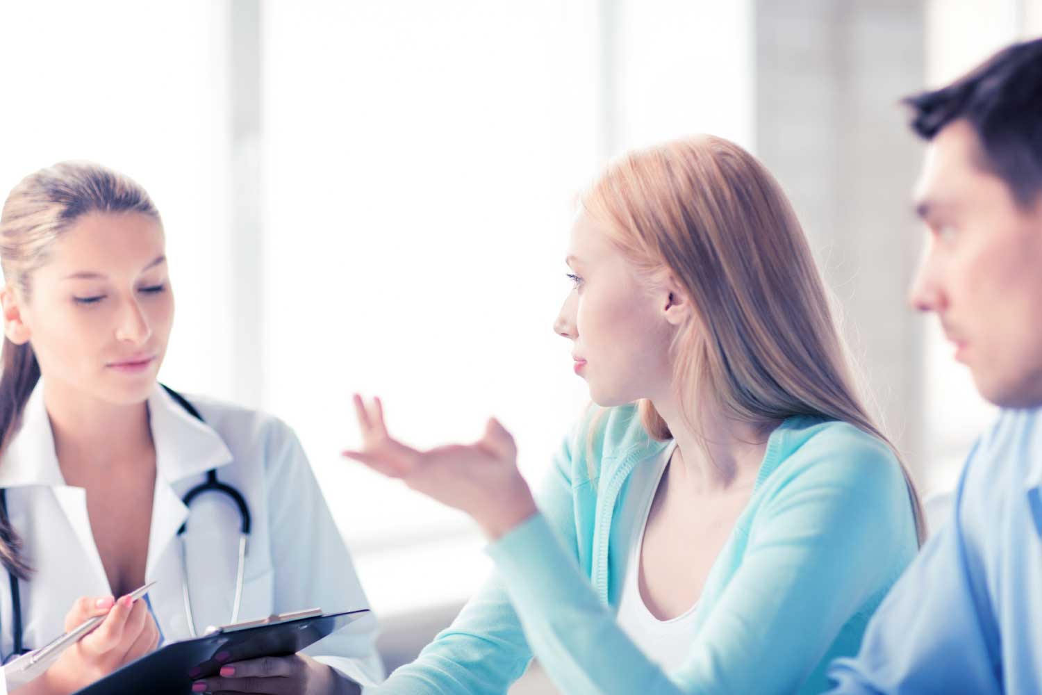 A couple consulting with a health professional.